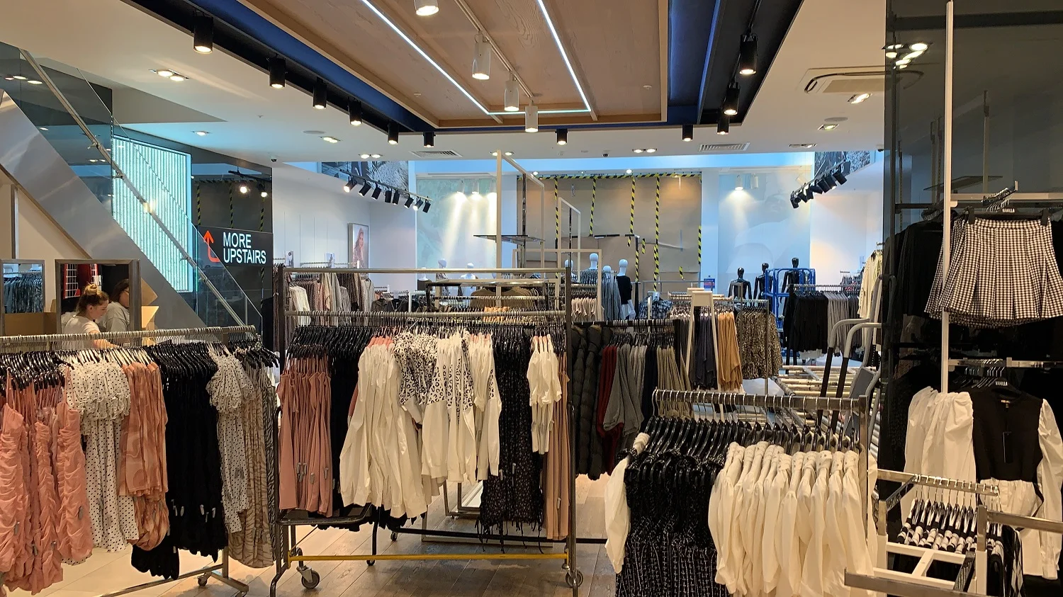 interior of clothing shop, dresses on hangers